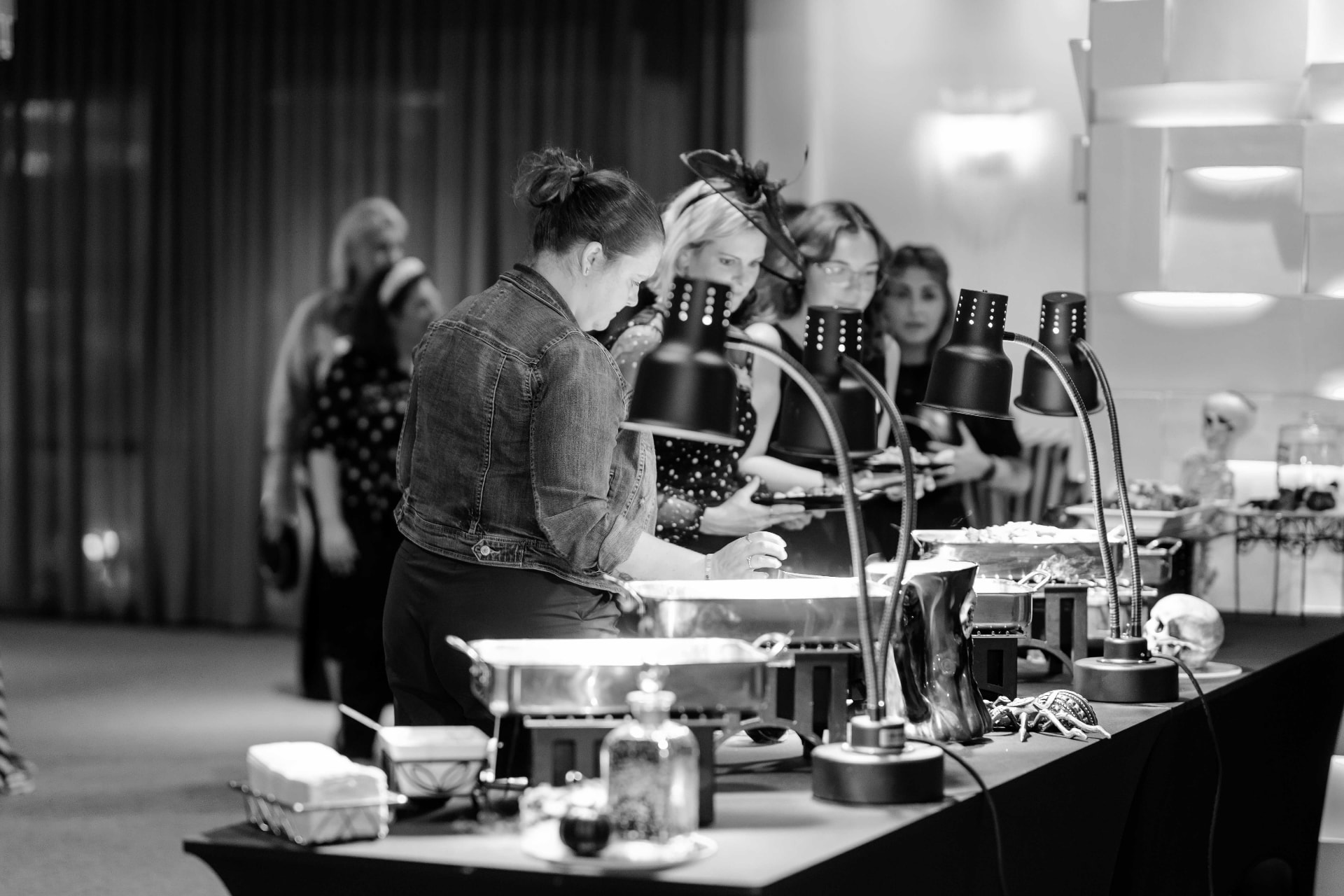 Guests being served at a buffet during an event at The MEZZ