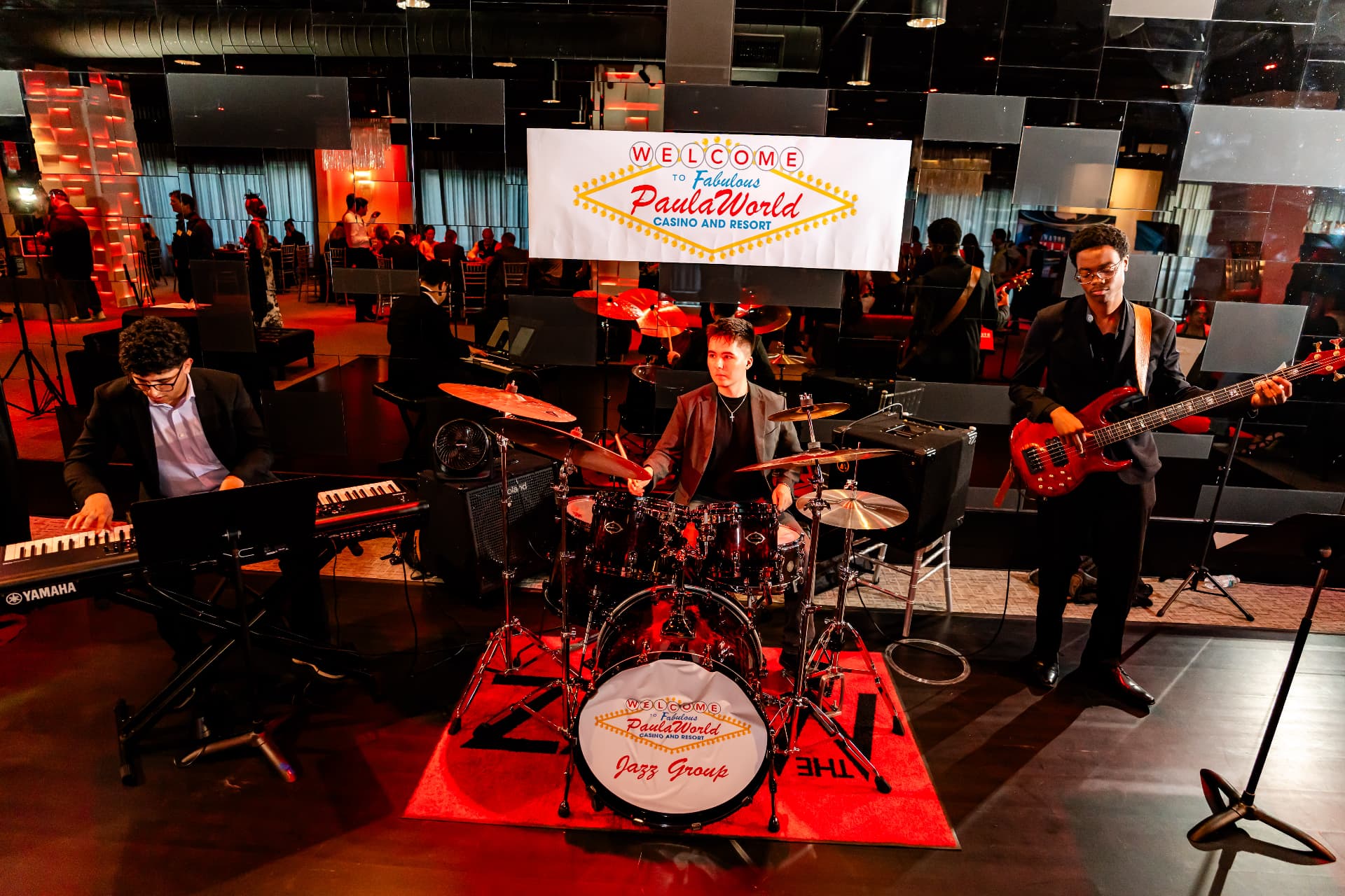A live band performing beside the dance floor during an event at The MEZZ